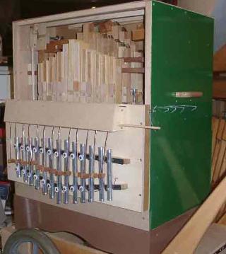 Figure 2 — A busker-organ pipe chest with the rank order visible — stopped flutes, open pipes, and a narrow-scaled string rank with ears and freins