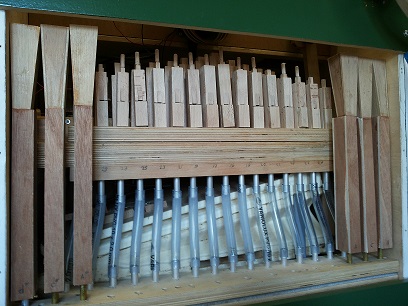 Figure 2 — A completed home-made free-reed "trumpet" pipe: beeswax-mounted reed-plate on a wood block with a rolled, papered and painted cardboard resonator