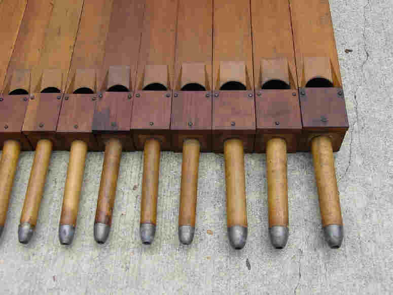Figure 2 — A wooden open flute pipe with ears fitted either side of the mouth