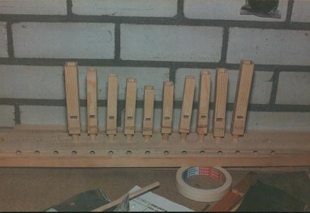 Figure 3 — A completed set of John Smith busker piccolo pipes with rolled-paper tubes graduated in diameter and acorn-topped stoppers