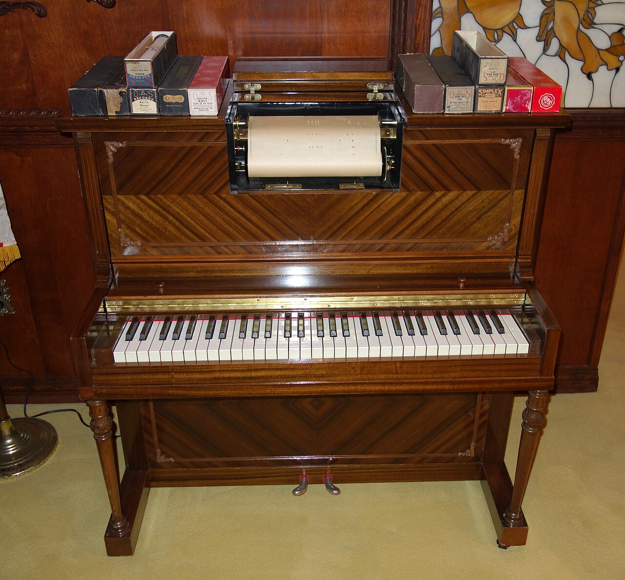 Figure 2 — A busker-organ spool box: supply and take-up spools flanking the tracker bar the punched roll is drawn across