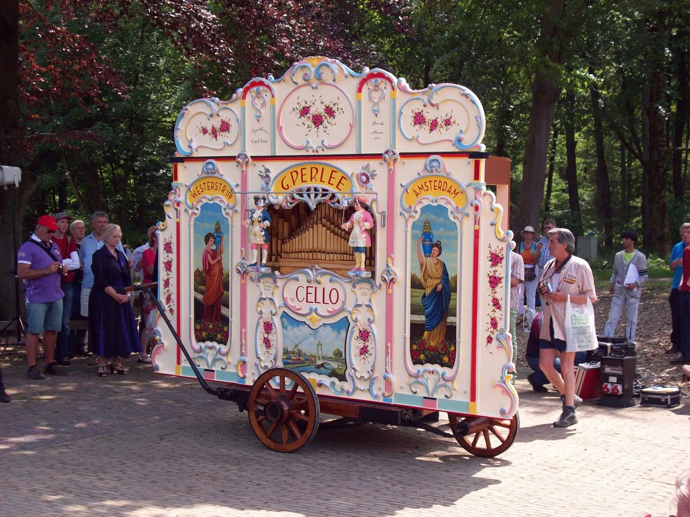 Figure 2 — A Dutch draaiorgel (street organ) on an Amsterdam street: a bright mirror-and-scroll front with jewel colours and moving figures.