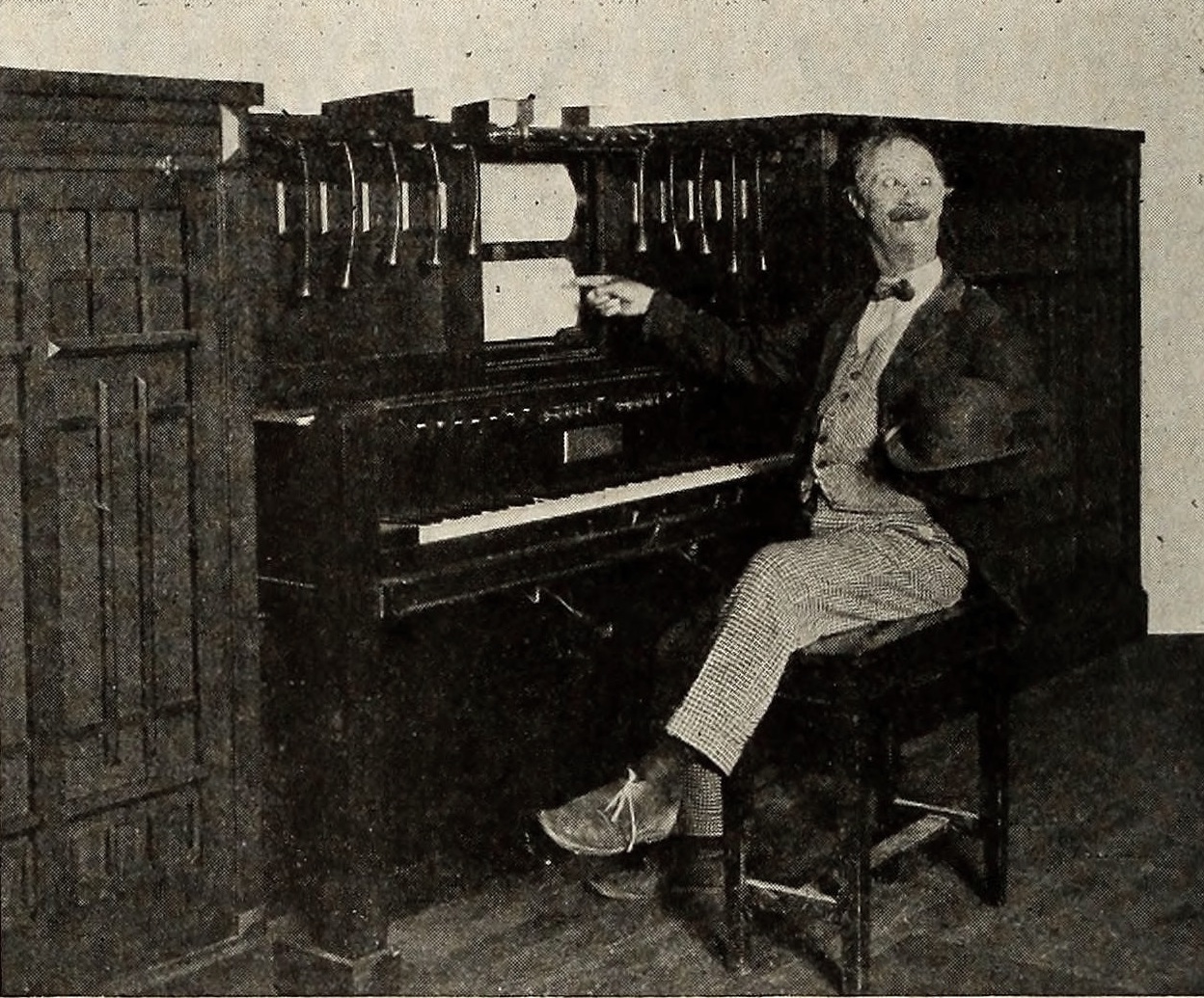 Figure 3 — An American Fotoplayer — a photoplayer built to accompany silent films, with a central player piano flanked by side chests of organ pipes and sound-effect devices worked by cords and buttons