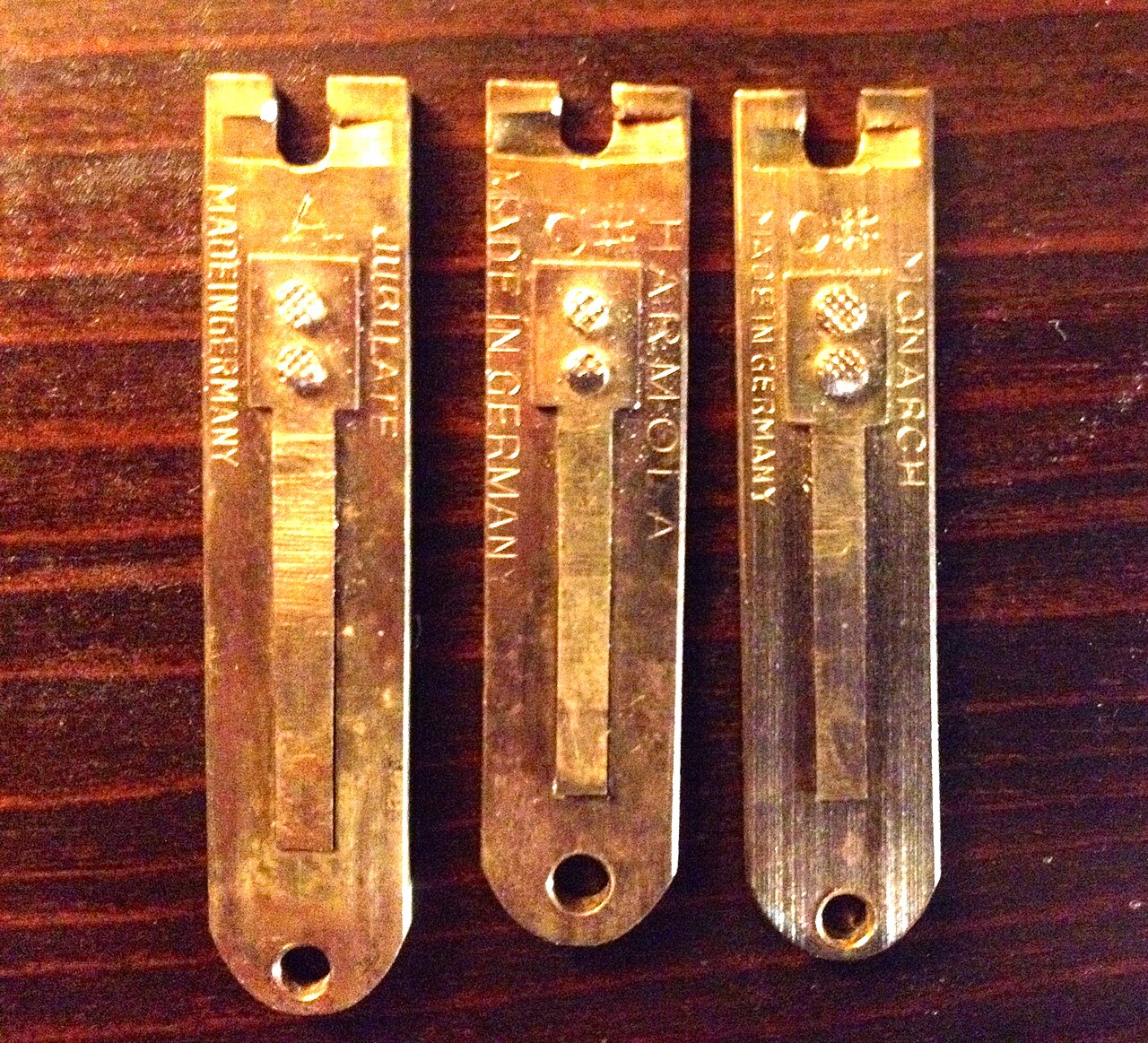 Figure 3 — Brass reed tongues and a set of small spring-steel valve springs from a mechanical-organ action — the two workhorse metals of the instrument.