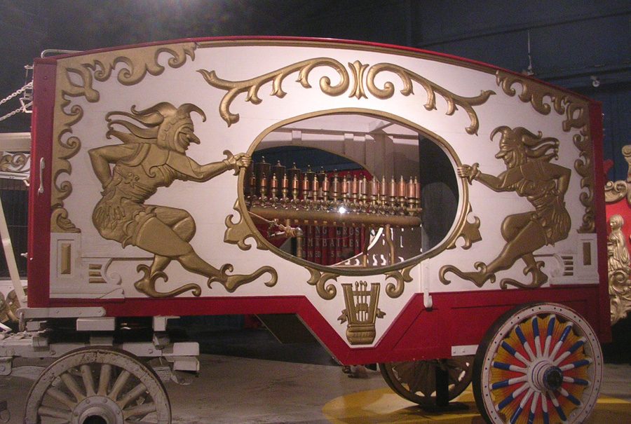 Figure 3 — A land-based circus calliope wagon: the fired boiler, gauge, and safety valve carried on the same chassis as the whistle bank.
