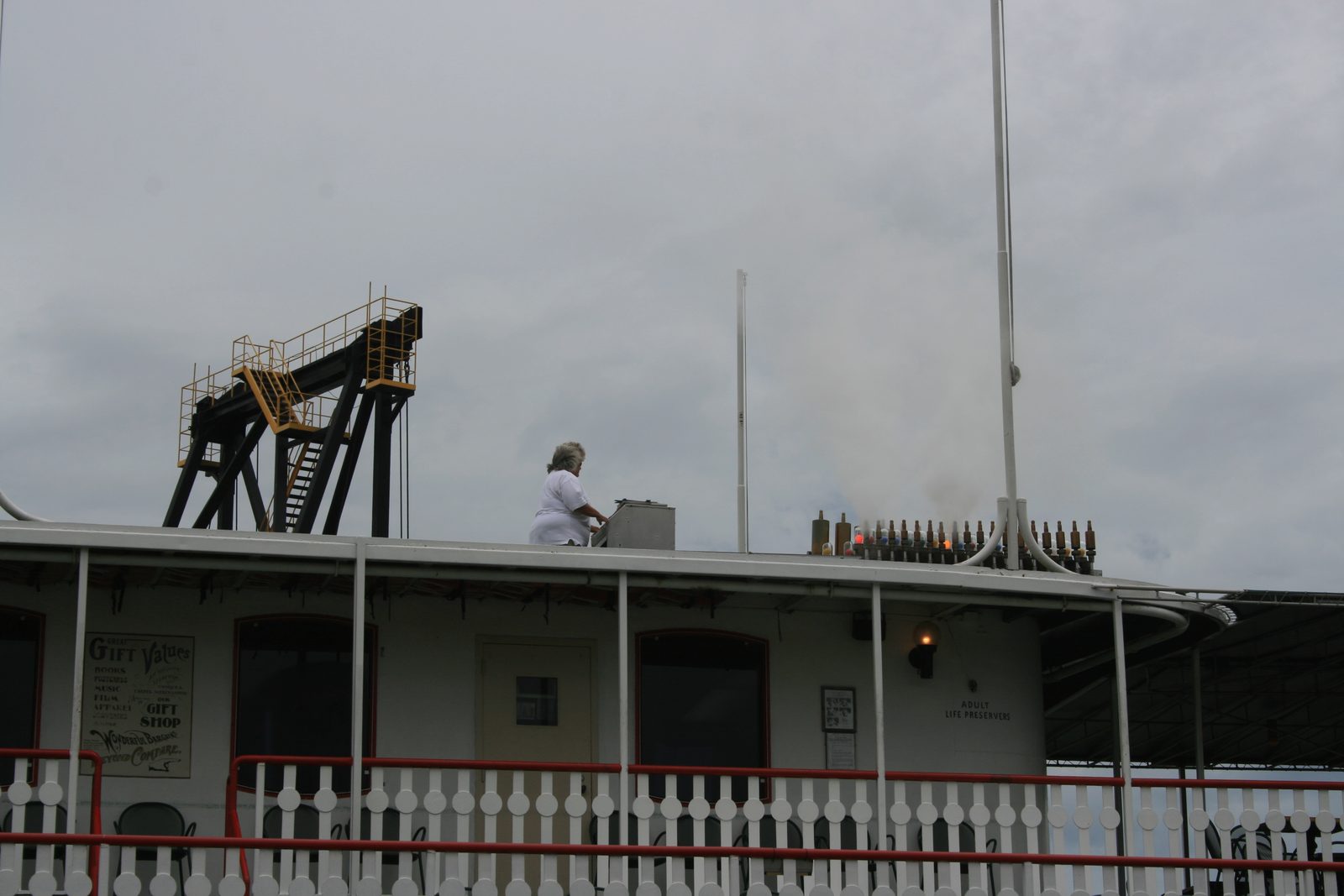Figure 3 — The Str. Natchez steam calliope in full cry, throwing plumes from its graded whistle bank, with the synchronized colored "aurora effect" lamps — one per whistle — firing in step with the notes.