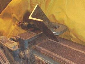 Figure 2 — A wooden bass pipe with a mitred (folded) foot, showing how the air column is bent to save height or clear a mechanism
