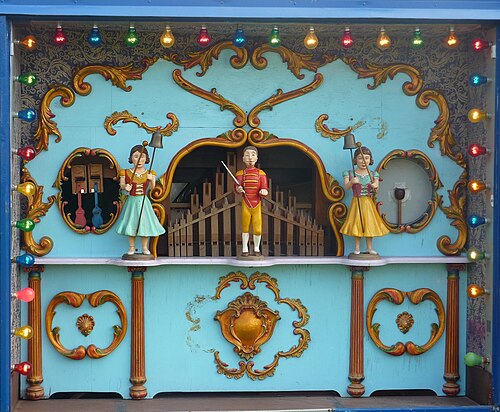 Figure 2 — Pierced fretwork / pipe-shade over the mouths of speaking display pipes, showing the open piercing that lets the front speak