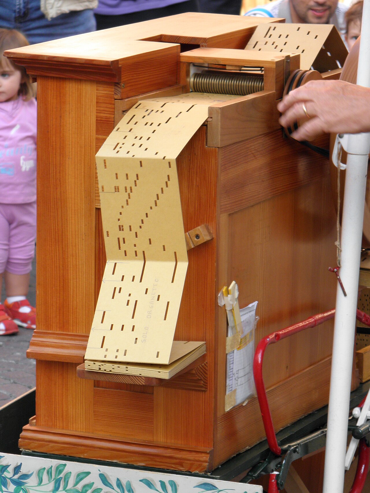 Figure 3 — A paper-roll frame mounted at the playing position inside a small crank organ case, reels and reading face visible