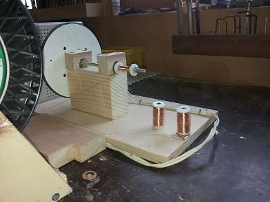 Figure 2 — The 31-note organ's MIDI note-action — home-wound copper solenoids over a layered groundplate chest, with soft-plastic valve parts fitted to cut the solenoid clatter.