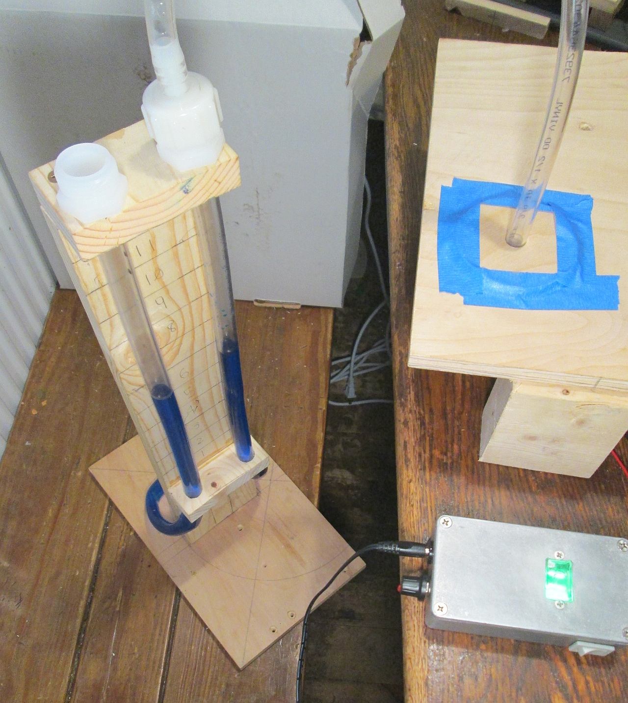 Figure 3 — A home-made U-tube water manometer teed into the wind supply of a voicing bench, the two water columns separated by about five inches
