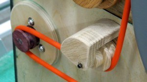 Figure 2 — A grooved driving wheel with a round 5 mm polyurethane drive cord running to the music spool, the belt form used extensively in hand-turned organs.